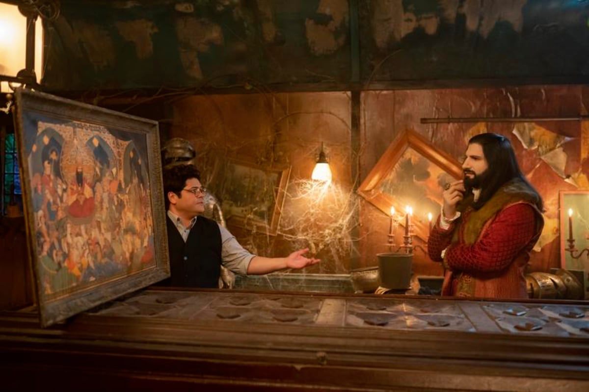 A Djinn grants Nandor wishes in What We Do in the Shadows Season 4. Nandor and Guillermo stand in front of a painting of Nandor's wives.