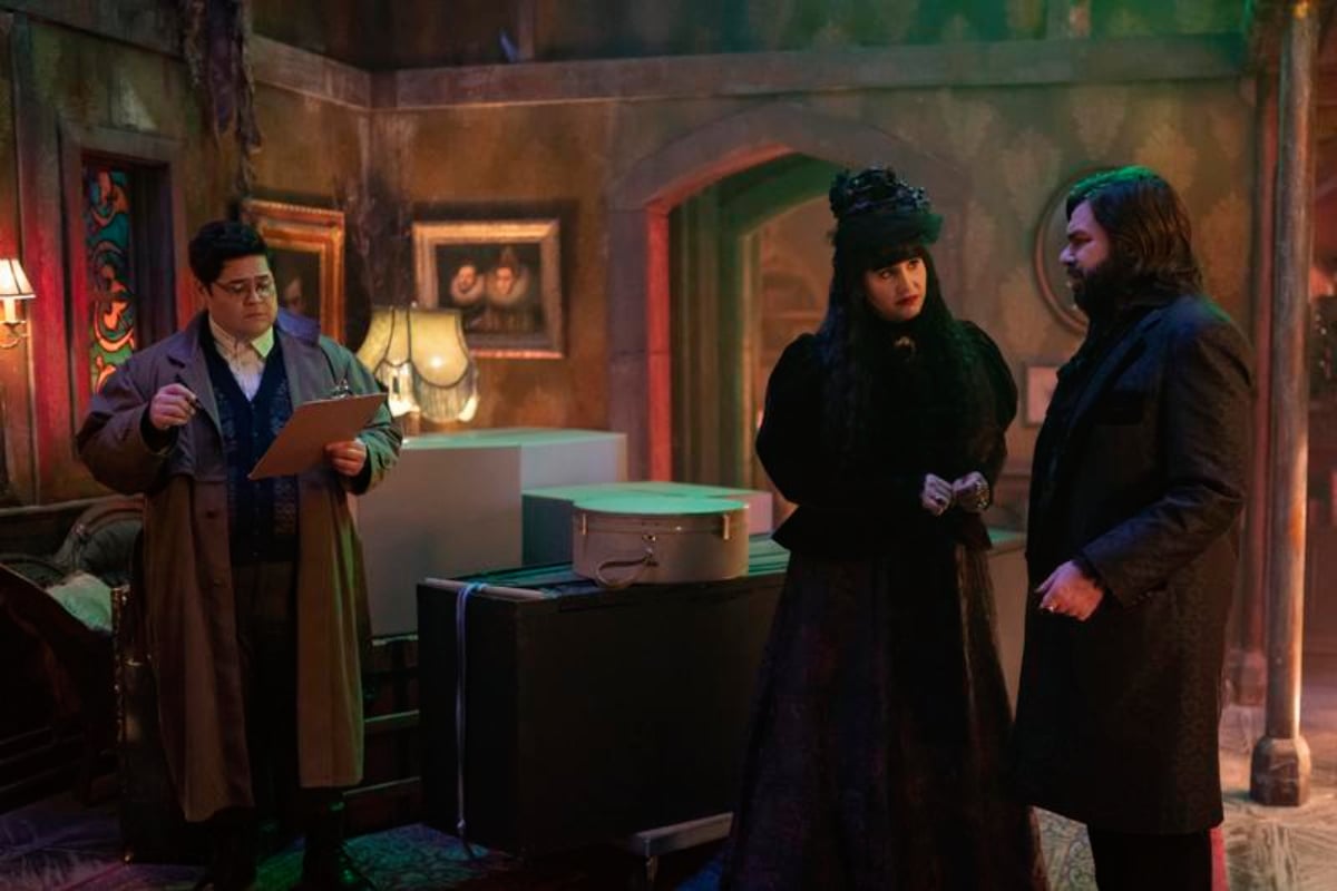 What We Do in the Shadows Season 3 has been nominated for seven Emmys. Guillermo holds a clipboard while Nadja and Laszlo look at each other.