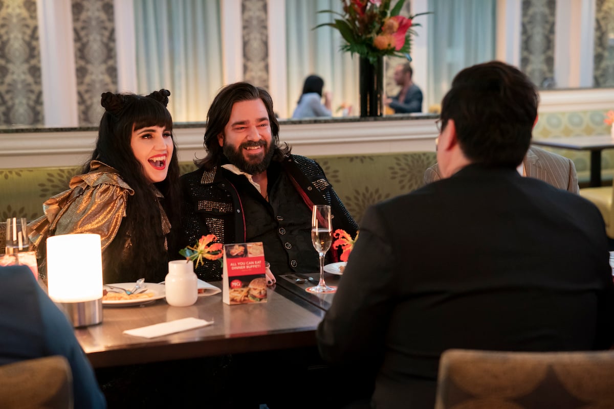 'What We Do in the Shadows': Laszlo (Matt Berry) and Nadja (Natasia Demetrious) cuddle in a booth, still in love