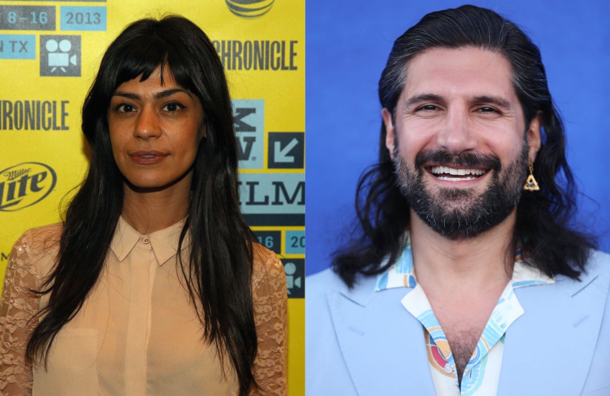 What We Do in the Shadows actors Parisa Fakhri and Kayvan Novak. Fakhri wears a nude top and Novak wears a blue suit jacket. 
