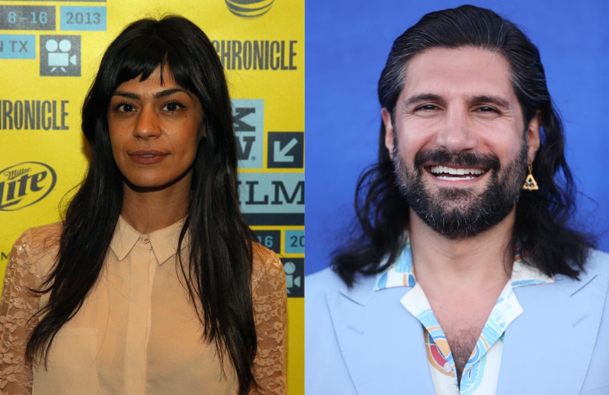 What We Do in the Shadows actors Parisa Fakhri and Kayvan Novak. Fakhri wears a nude top and Novak wears a blue suit jacket.