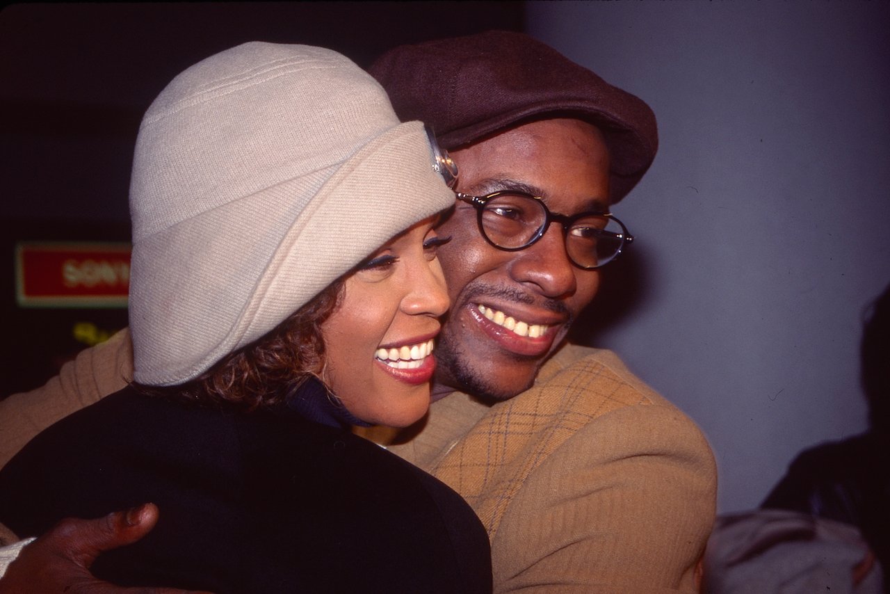 Whitney Houston and Bobby Brown embrace in photo; Houston married Brown in 1992 with her best friend Robyn Crawford by her side