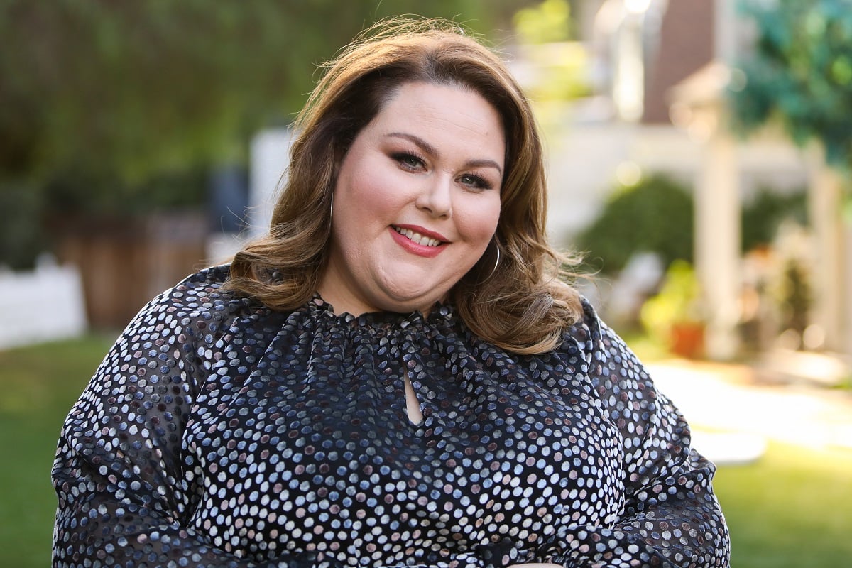Chrissy Metz, who has been targeted for her weight, smiling in a polka dot top