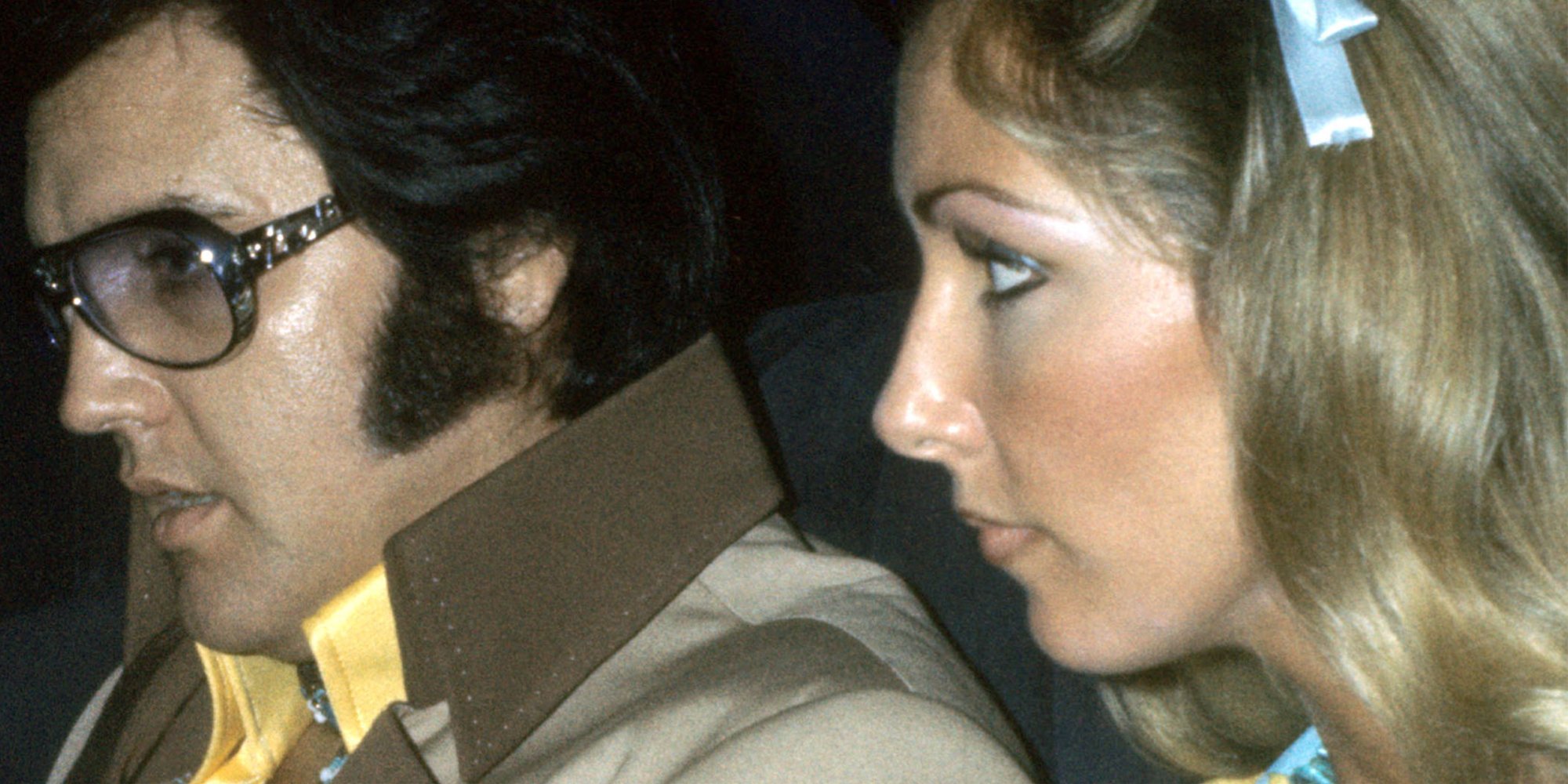 Elvis Presley and Linda Thompson are photographed in a car in 1976.