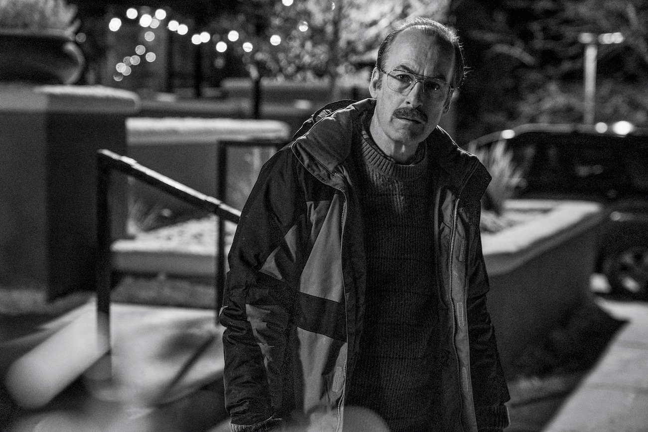 Gene Takavic (Bob Odenkirk) sits against an exterior wall in 'Better Call Saul' Season 6 Episode 11 'Breaking Bad'