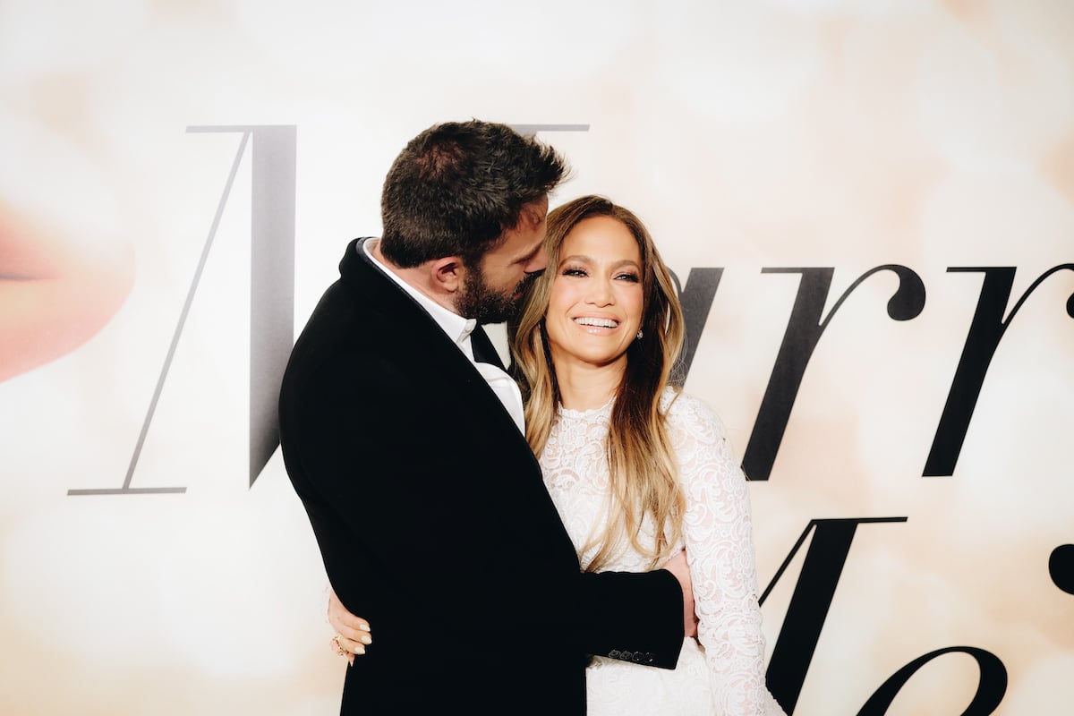 Months prior to their real-life wedding, Ben Affleck and Jennifer Lopez attend the Los Angeles special screening of "Marry Me" posing together in front of the movie banner.