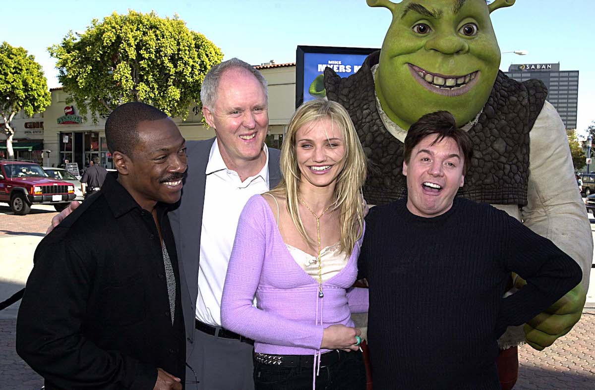 'Shrek' cast members Eddie Murphy, John Lithgow, Cameron Diaz, and Mike Myers posing with a Shrek character in costume