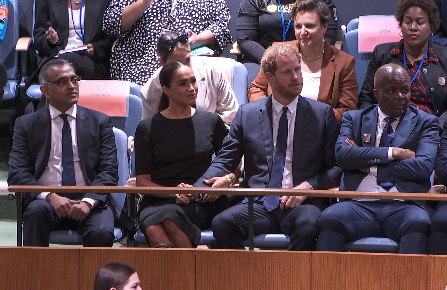 Meghan Markle pulls Prince Harry's arm to her lap at the UN general assembly