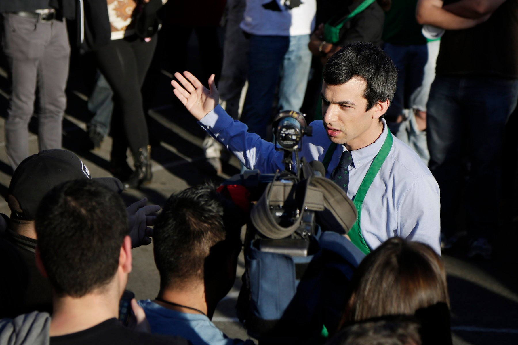Nathan Fielder, host of 'Nathan For You,' dressed in a Starbucks uniform in a crowd