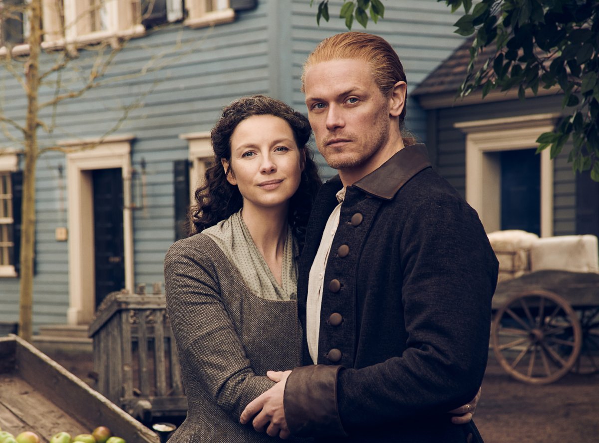 Outlander season 7 stars Sam Heughan and Caitriona Balfe pose as Jamie and Claire Fraser in an official image from season 6