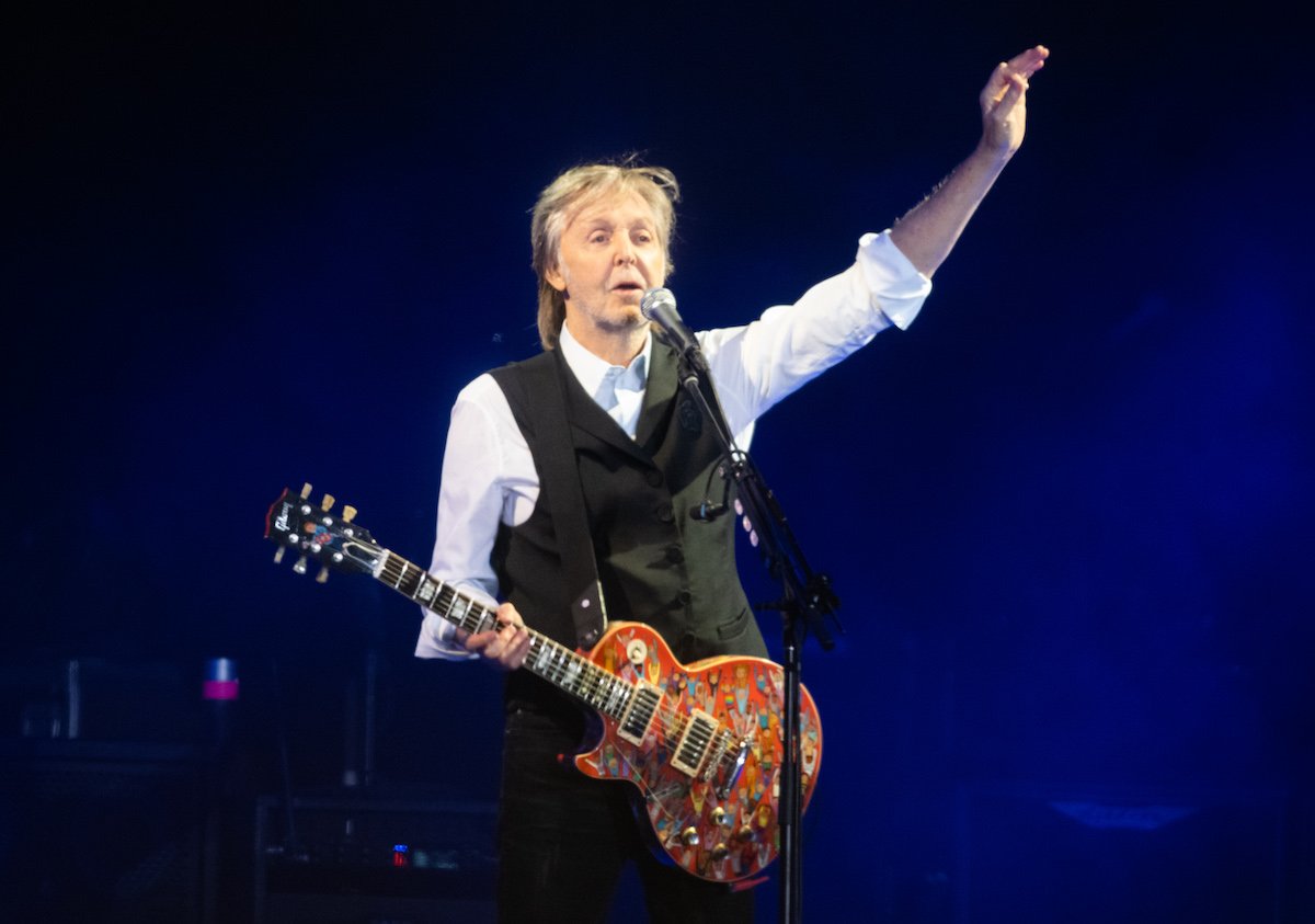 Paul McCartney on stage with a guitar