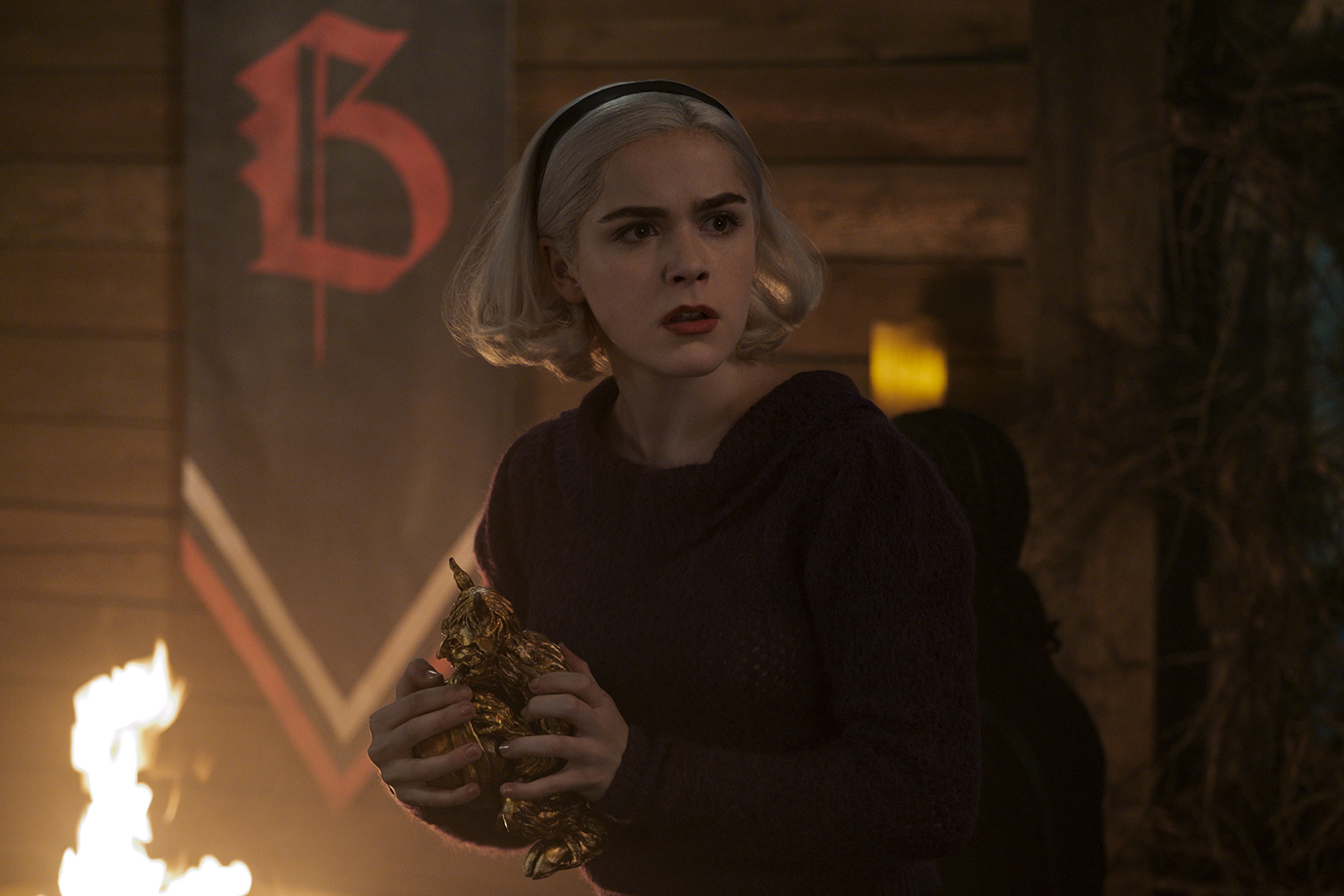 Kiernan Shipka as Sabrina Spellman in Chilling Adventures of Sabrina, years before she visits Riverdale alive and well.