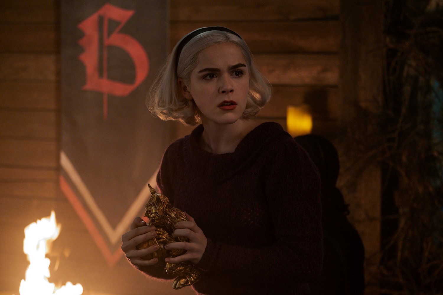 Kiernan Shipka as Sabrina Spellman in Chilling Adventures of Sabrina, years before she visits Riverdale alive and well.