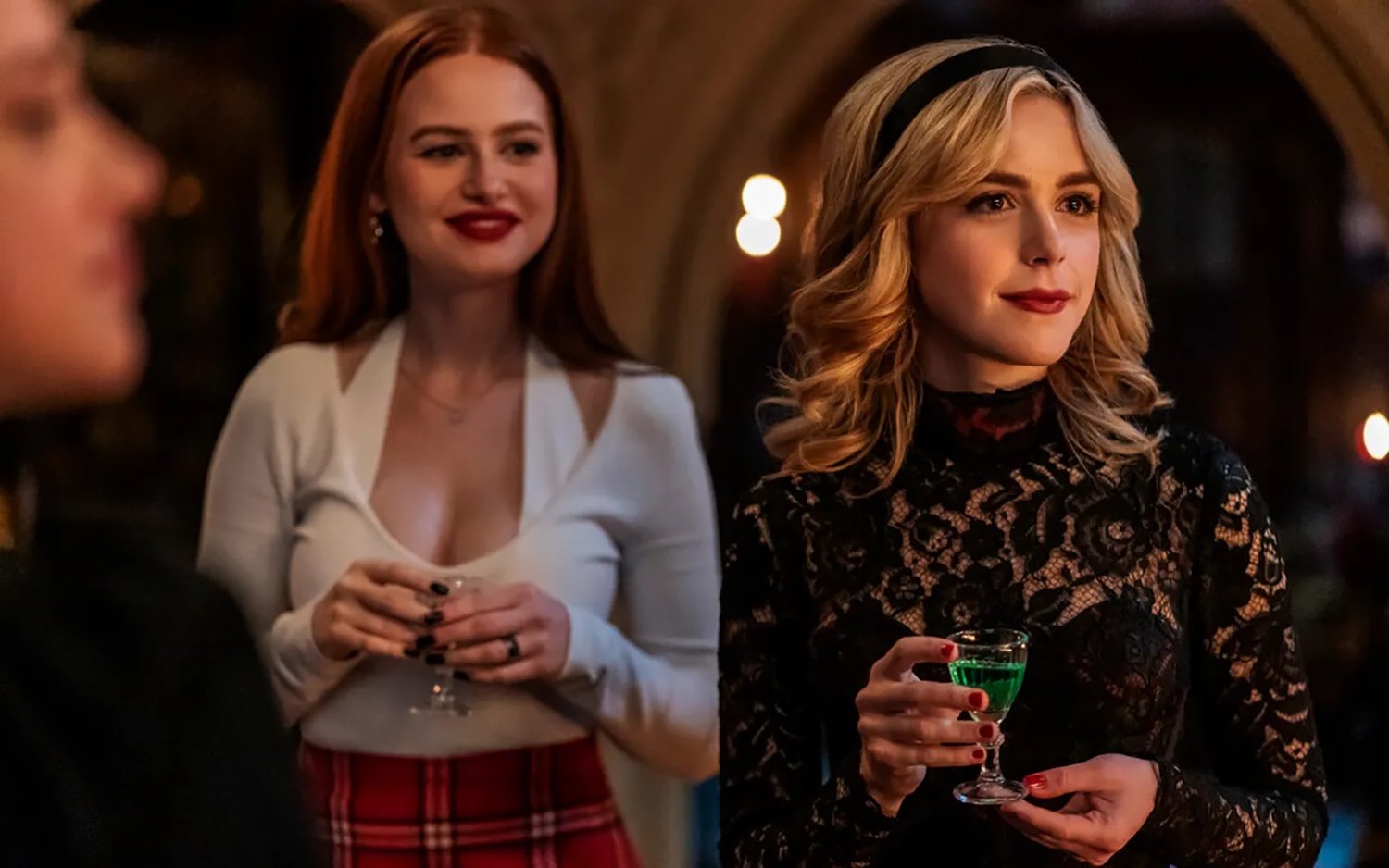 Madelaine Petsch as Cheryl Blossom and Kiernan Shipka as Sabrina Spellman in Riverdale Season 6 Episode 19.