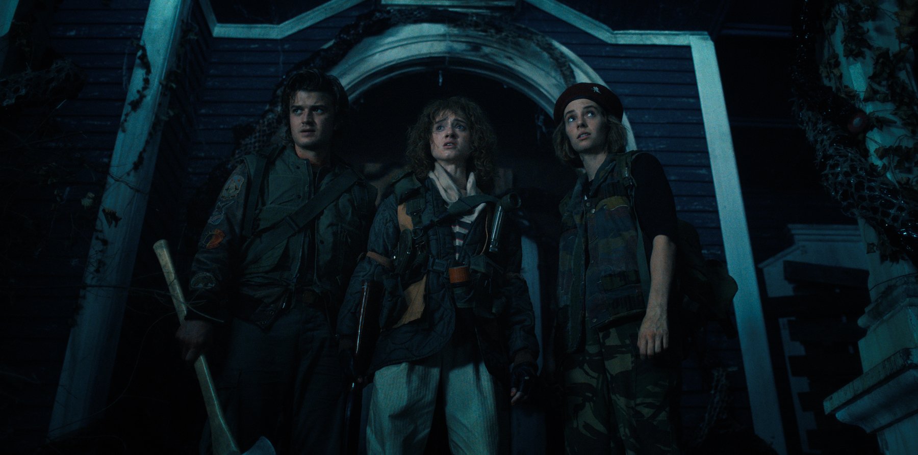 Steve (Joe Keery), Nancy (Natalia Dyer), and Robin (Maya Hawke) outside of the Creel house, a real filming location in Georgia, in 'Stranger Things' 4