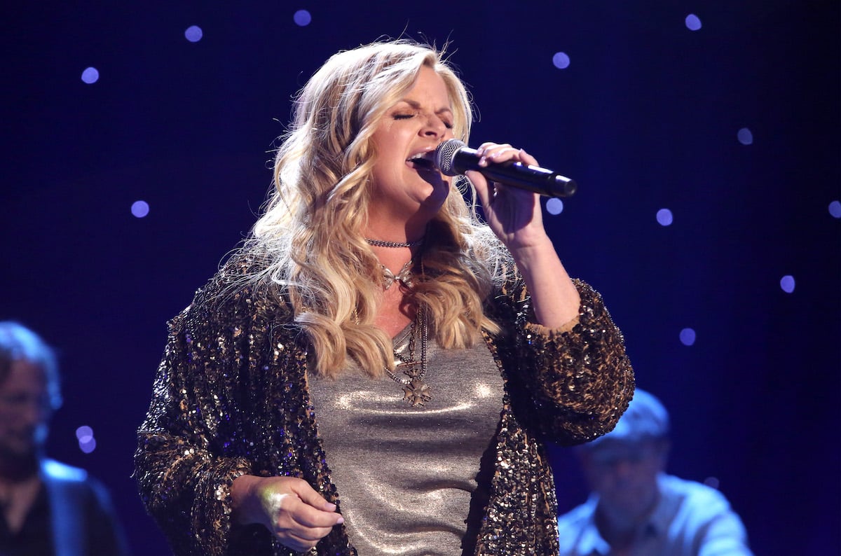 Trisha Yearwood singing into a microphone