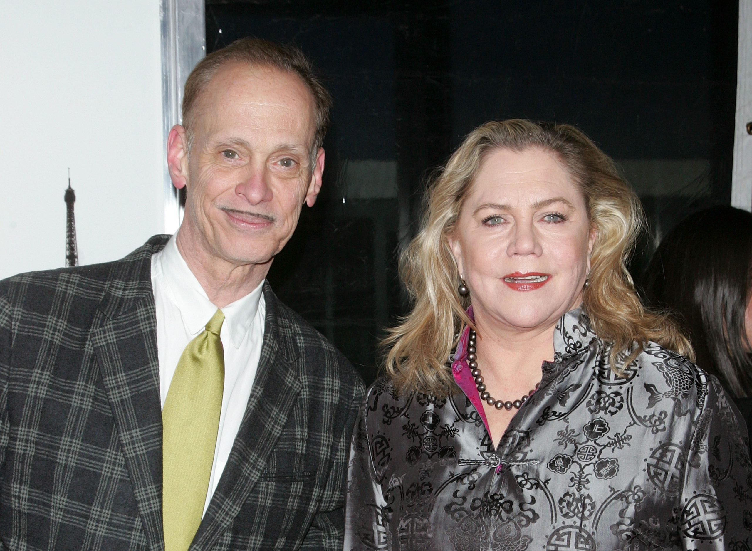 John Waters and Kathleen Turner attend the "From Paris With Love" premiere at the Ziegfeld Theatre