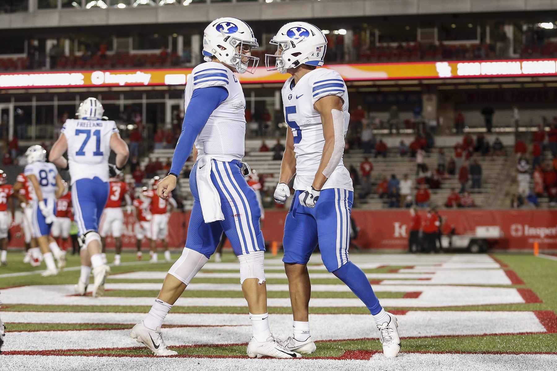 Zach Wilson #1 of the BYU Cougars congratulates Dax Milne #5 after a fourth quarter touchdown against the Houston Cougars