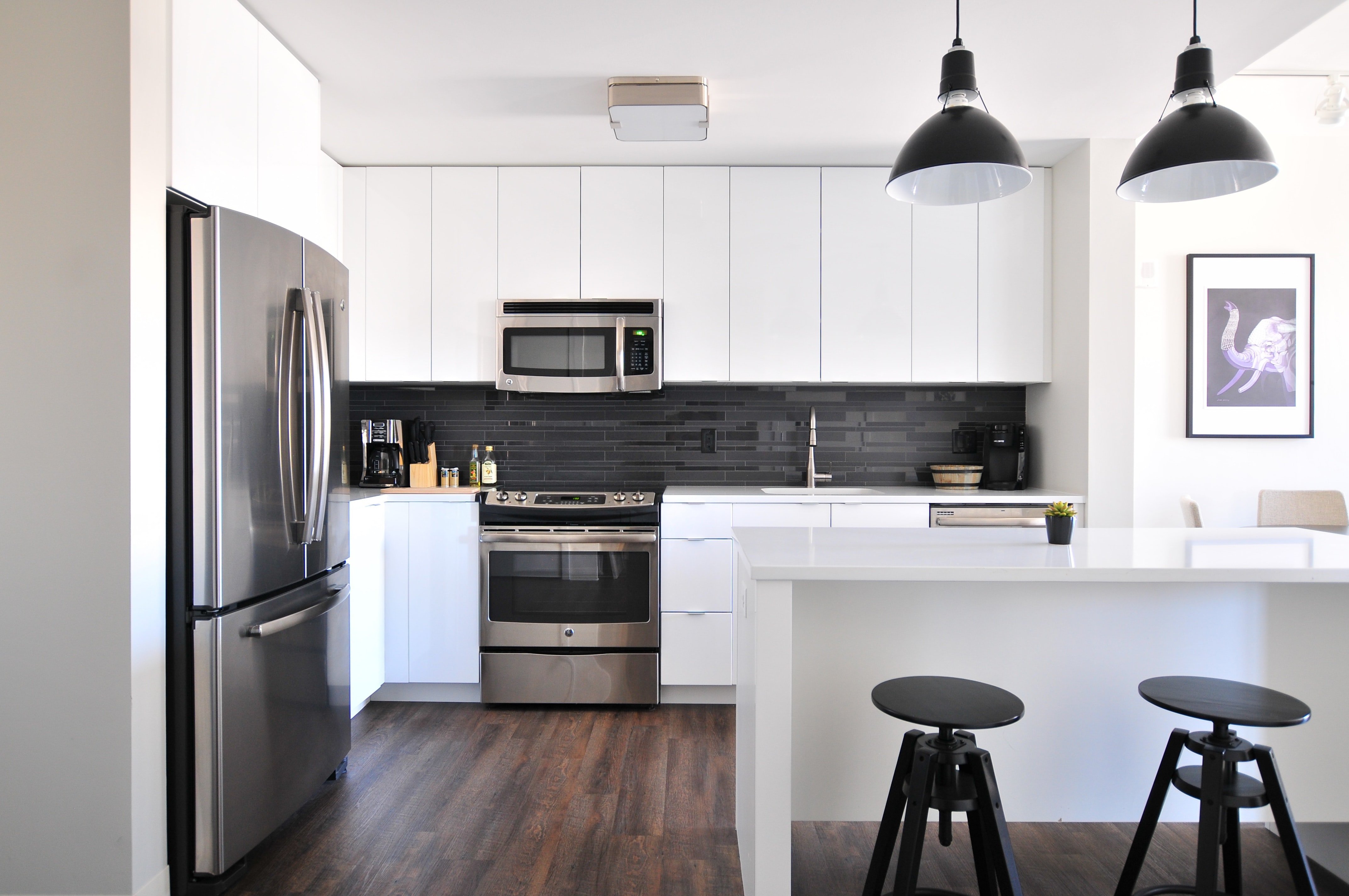 A modern black and white kitchen.