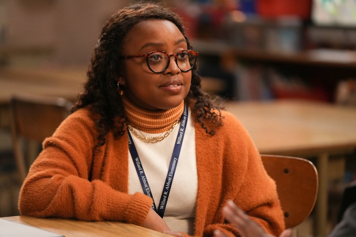 'Abbott Elementary' Emmy nominee Quinta Brunson sits in a student desk