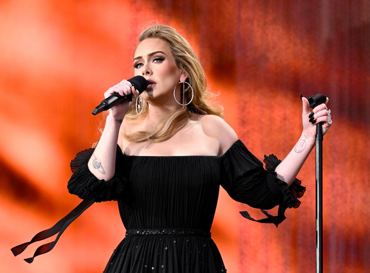 Adele, who said her friends didn't originally like VMA-nominated song, 'Easy on Me', sings into a microphone