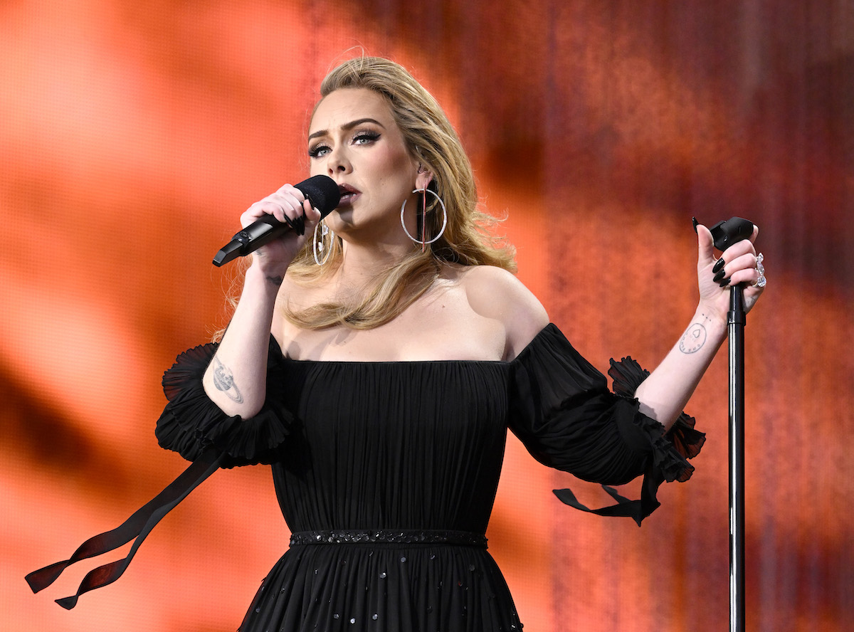 Adele, who recently rescheduled her postponed Las Vegas residency shows, performs on stage.