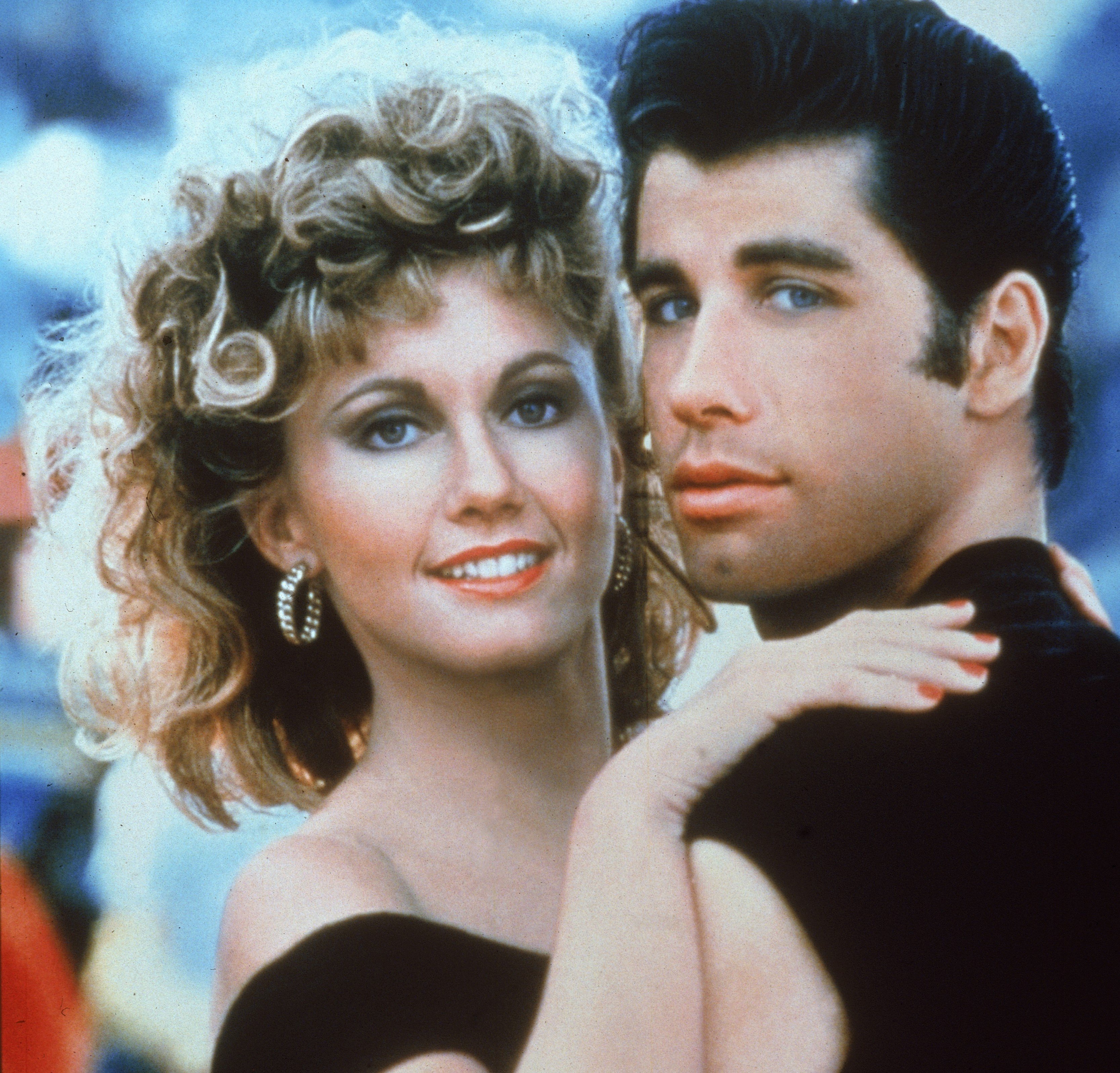 Olivia Newton-John and John Travolta wearing black in 'Grease'