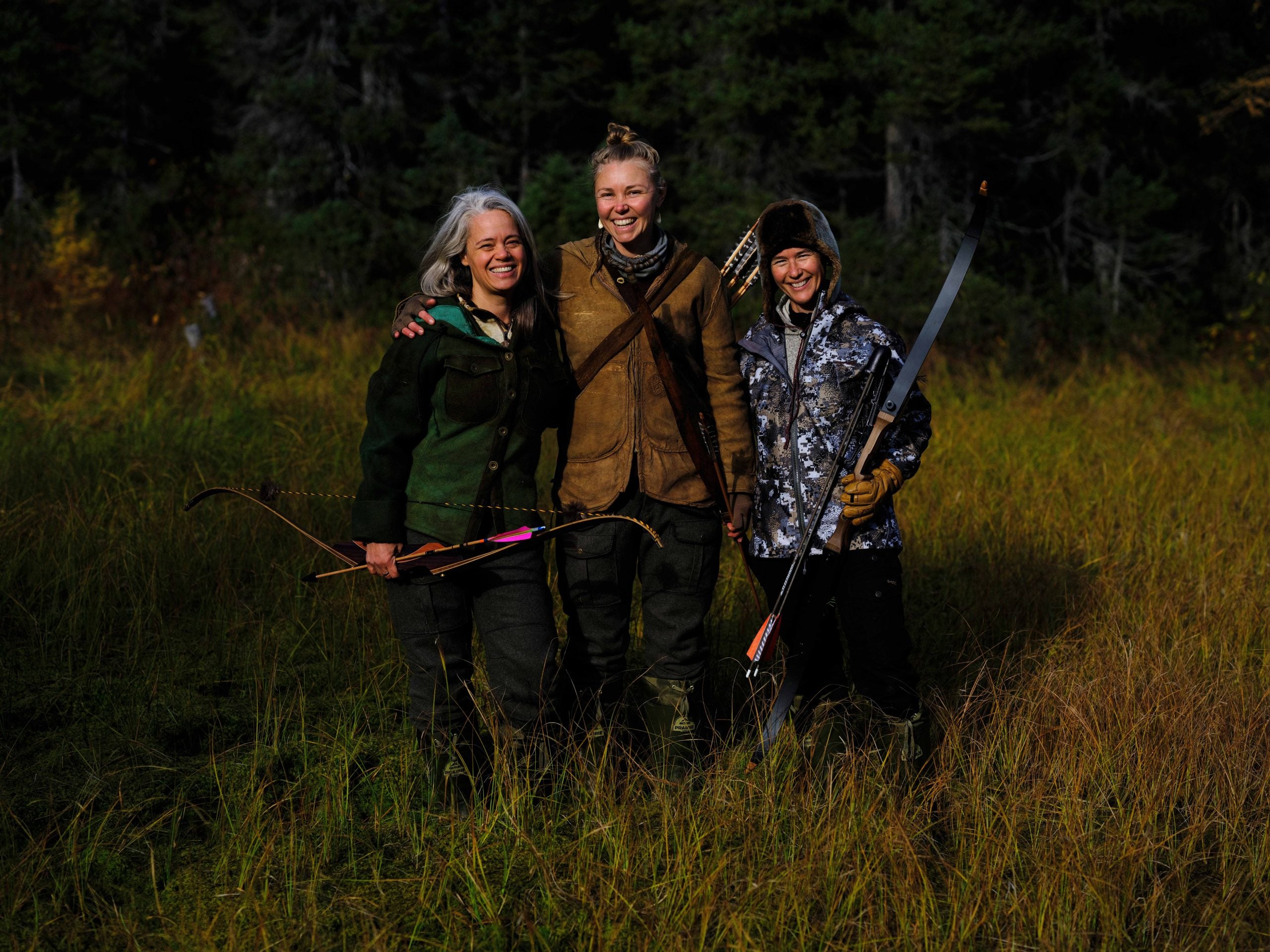 'Alone: Frozen' contestants Woniya, Callie, and Michell standing together