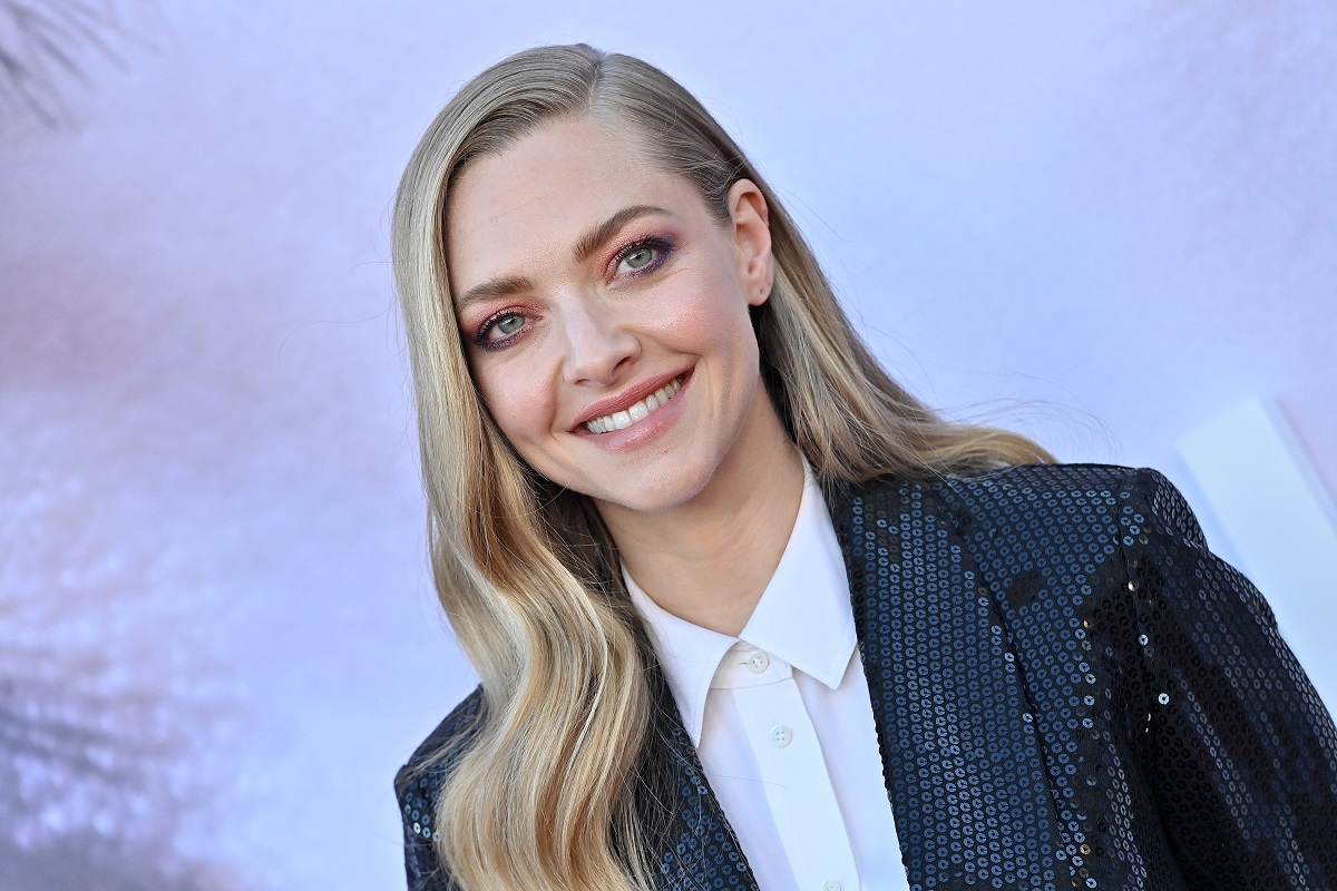 Amanda Seyfried smiling while wearing a suit.