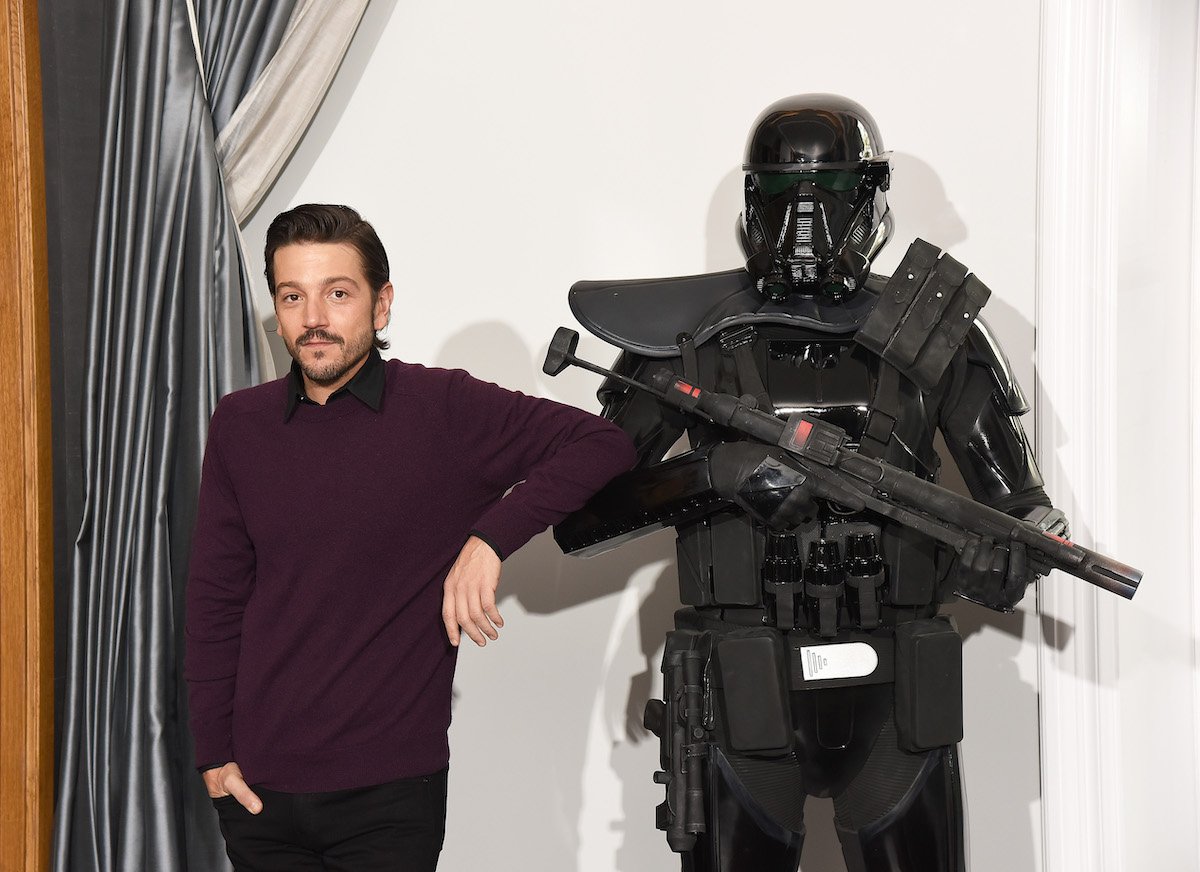 'Andor' star Diego Luna leans on a Death Trooper at the 'Rogue One' London photocall