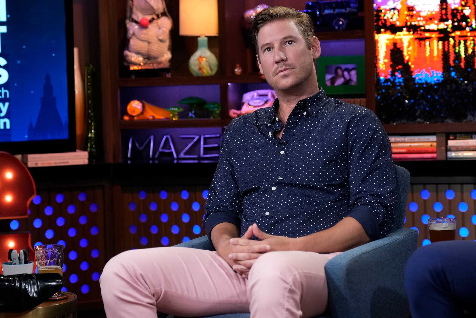 Austen Kroll from Southern Charm sits with hands folded in his lap