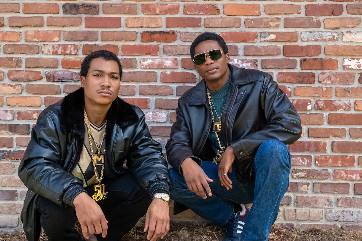 Demetrius “Lil Meech” Flenory Jr as Big Meech and Da'Vinchi as Southwest T kneeling against a brick wall wearing leather jackets on 'BMF