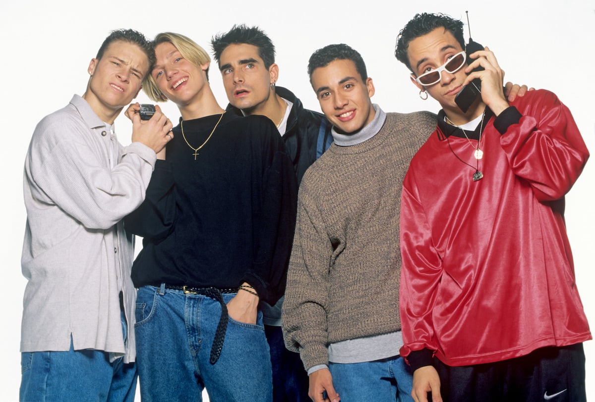 Backstreet Boys members Brian Littrell, Nick Carter, Kevin Richardson, Howie Dorough, and AJ McLean complete a photoshoot in 1996