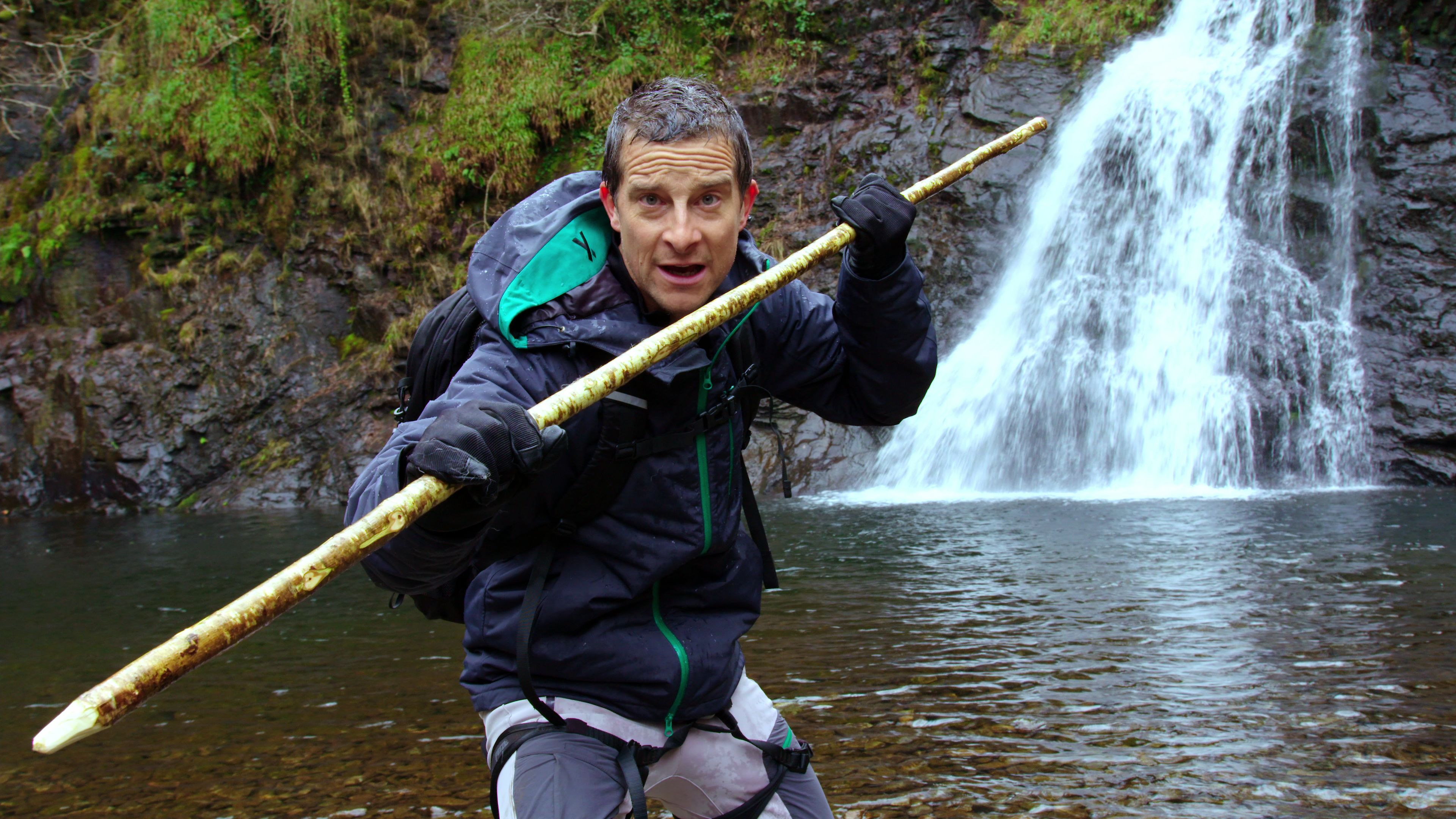 Bear Grylls holding a spear in survival show 'You Vs. Wild'