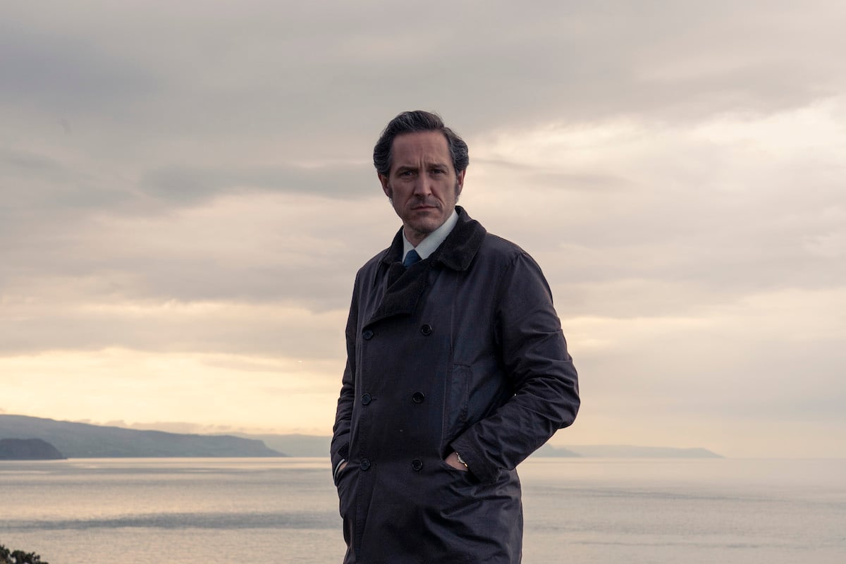 Bertie Carvel as Adam Dalgliesh, with his hands in his pockets, in 'Dalgliesh'