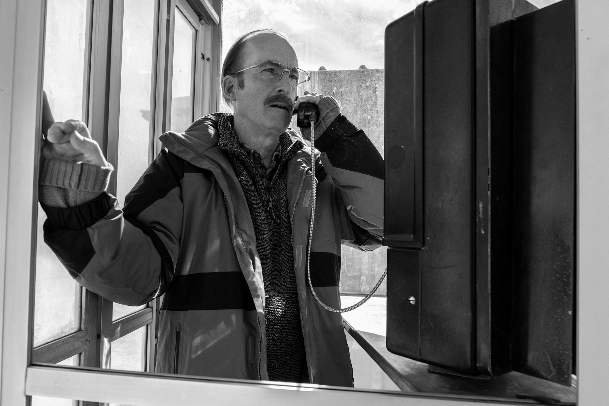 Bob Odenkirk as Gene Takovic in 'Better Call Saul' Season 6 Episode 11, "Breaking Bad," He's standing in a phone booth and talking into a payphone.