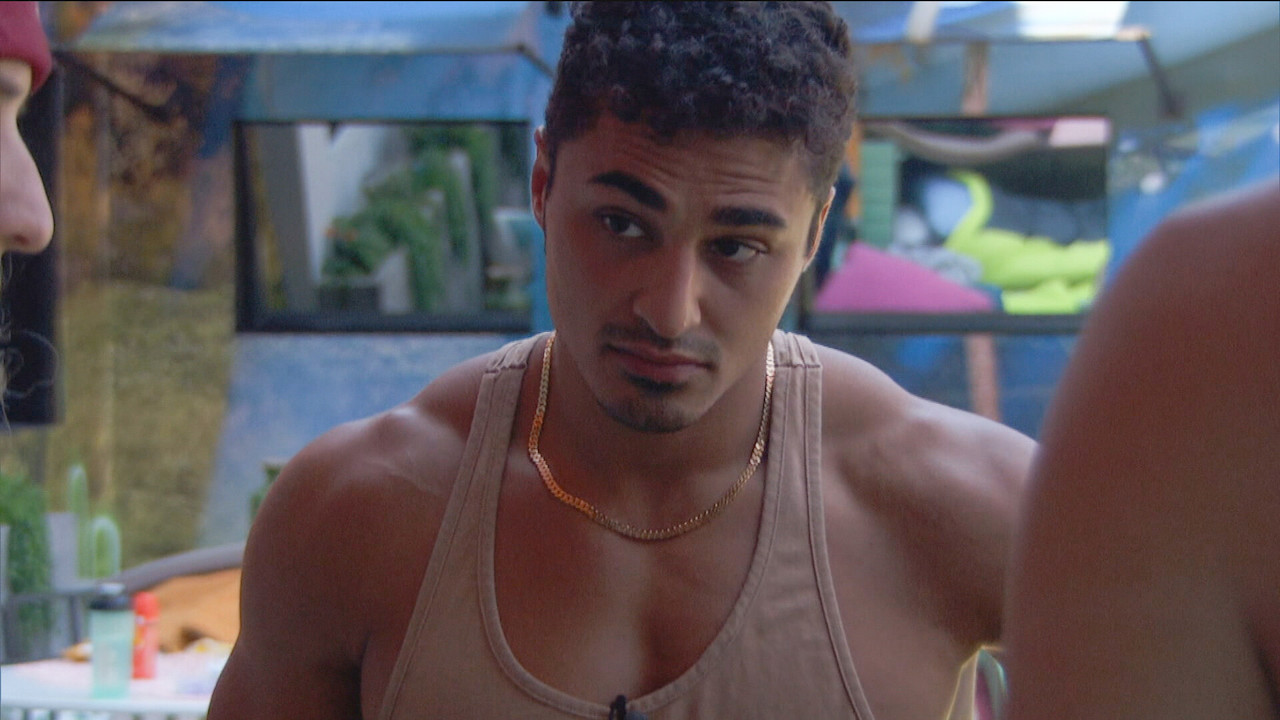 Joseph Abdin wears a tank top and gold chain outside on 'Big Brother 24'.