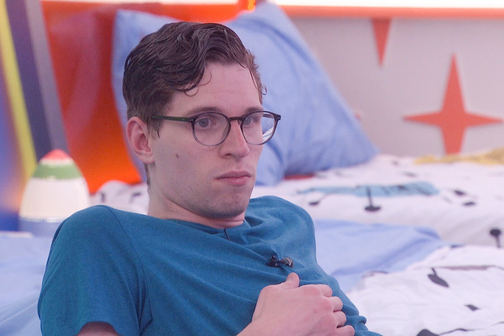 Michael Bruner, a houseguest in 'Big Brother 24' on CBS, wears a blue shirt.