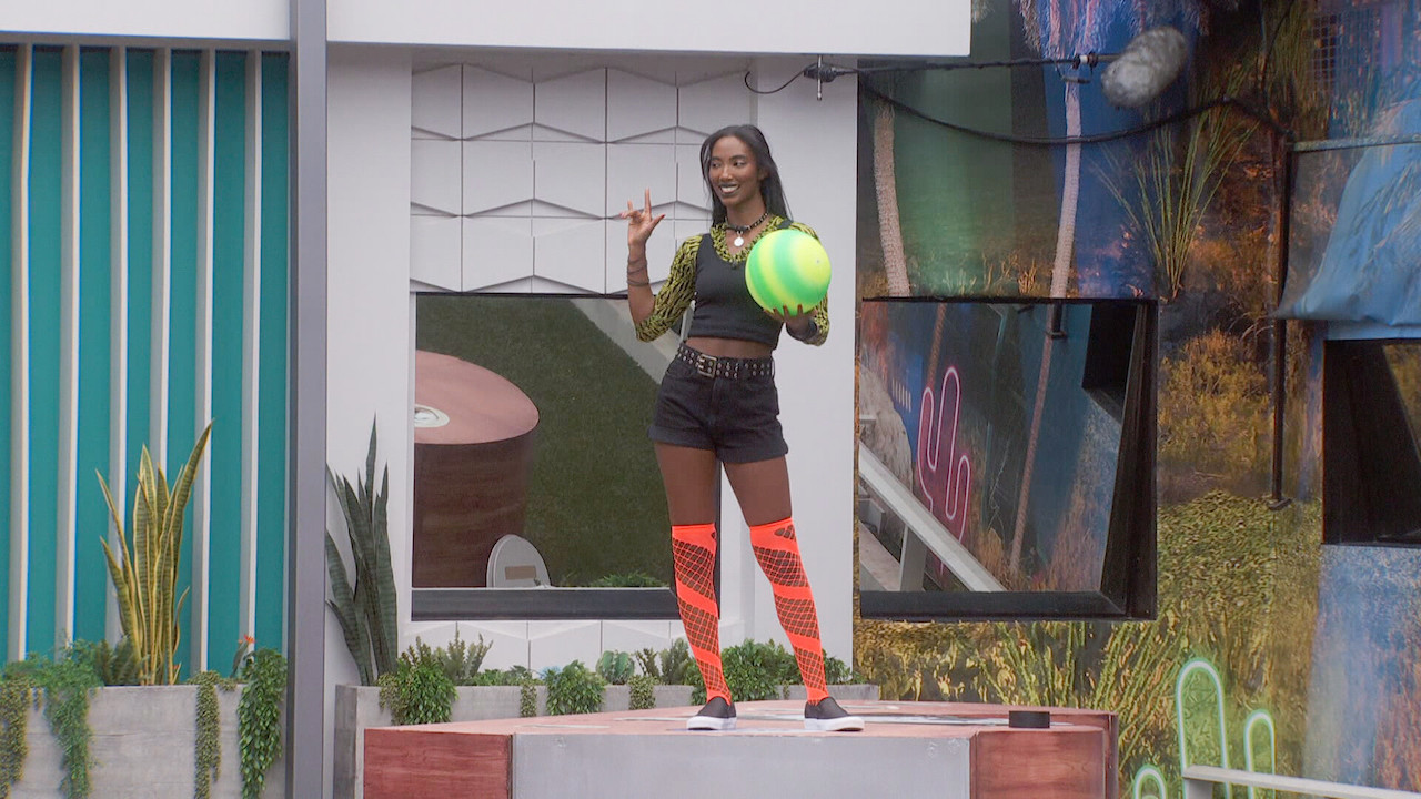 Taylor Hale is dressed in punk fishnets and shorts while holding a green ball on 'Big Brother 24'.