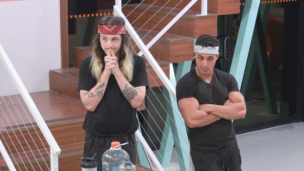 Matthew Turner and Joseph Abdin stand next to each other in the kitchen watching other houseguests on 'Big Brother 24'.