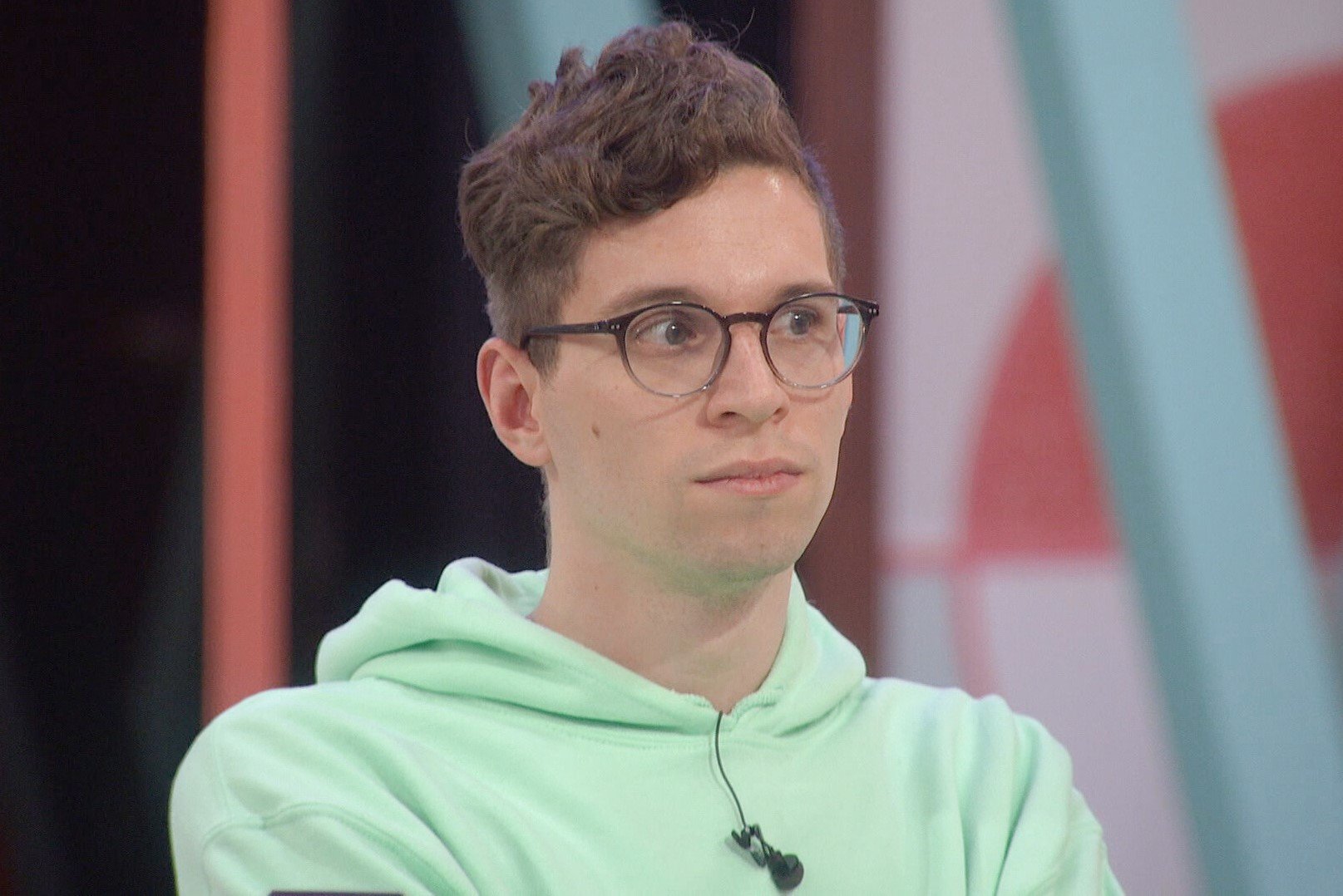 Michael Bruner, who won the Power of Veto during 'Big Brother 24' week eight, wears a mint green hoodie and glasses.