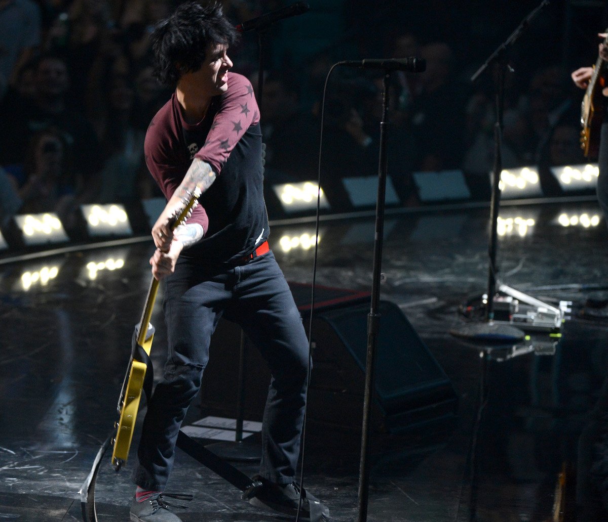 Billie Joe Armstrong of Green Day smashes his guitar onstage during the 2012 iHeartRadio Music Festival