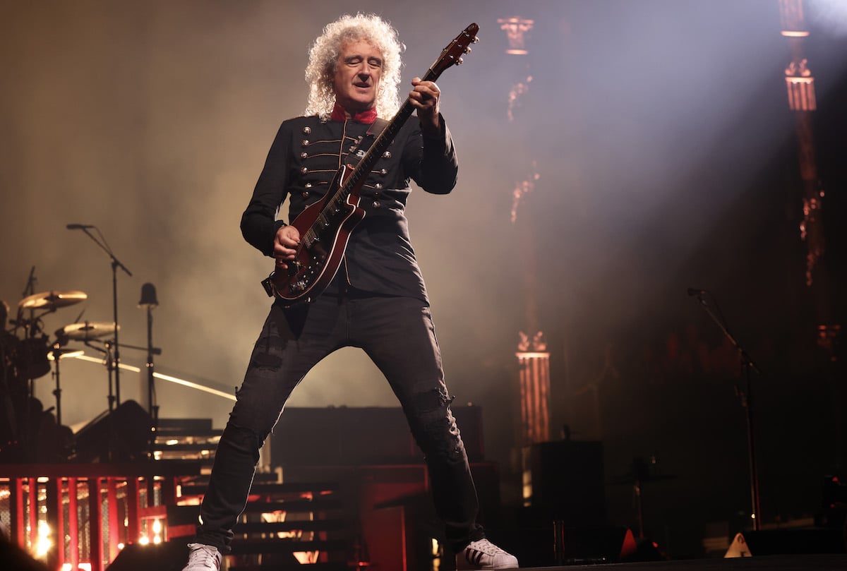 Brian May performing on stage