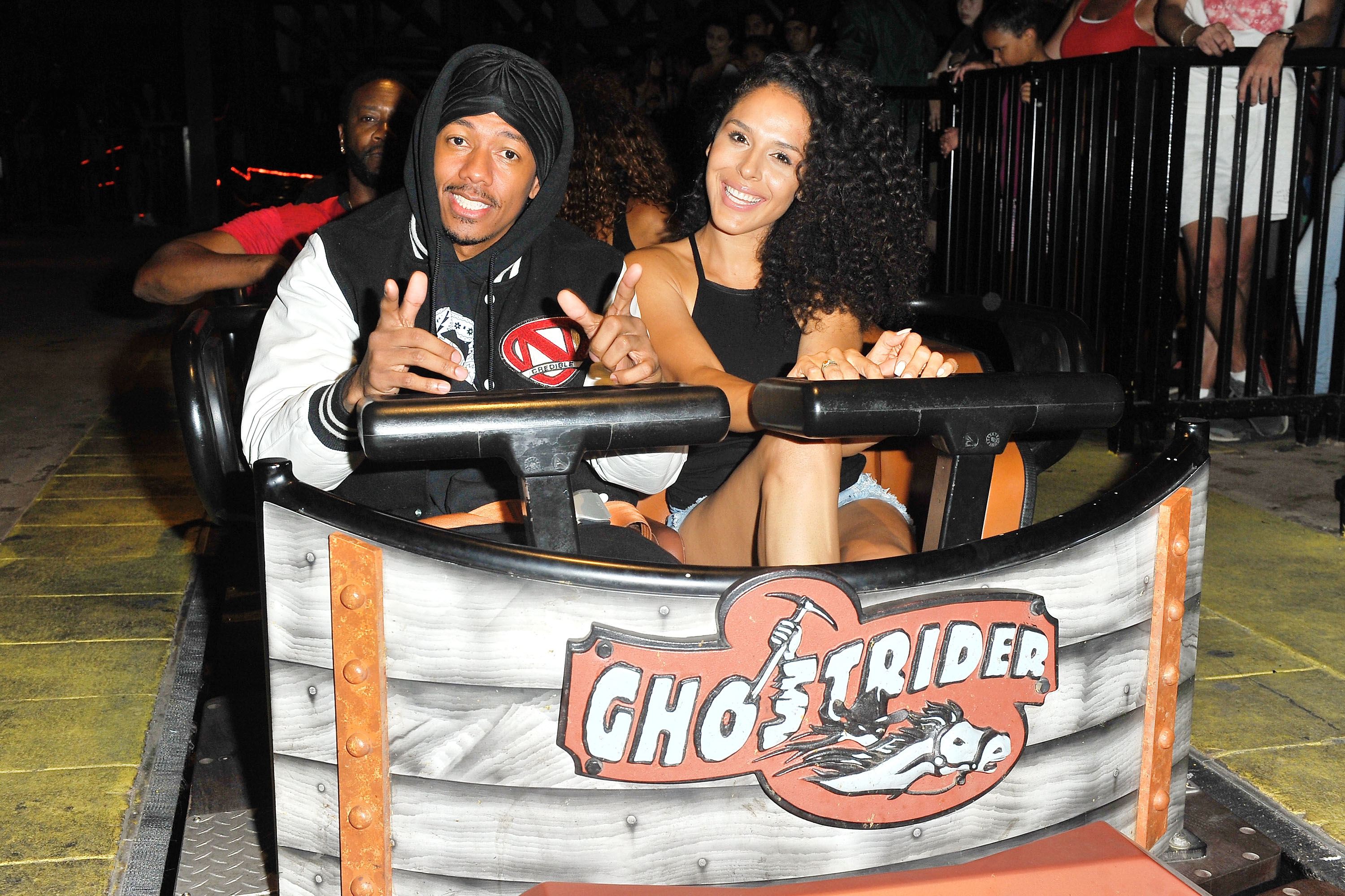 Nick Cannon and Brittany Bell ride the 'Ghostrider' Roller Coaster at Knott's Berry Farm on September 1, 2017