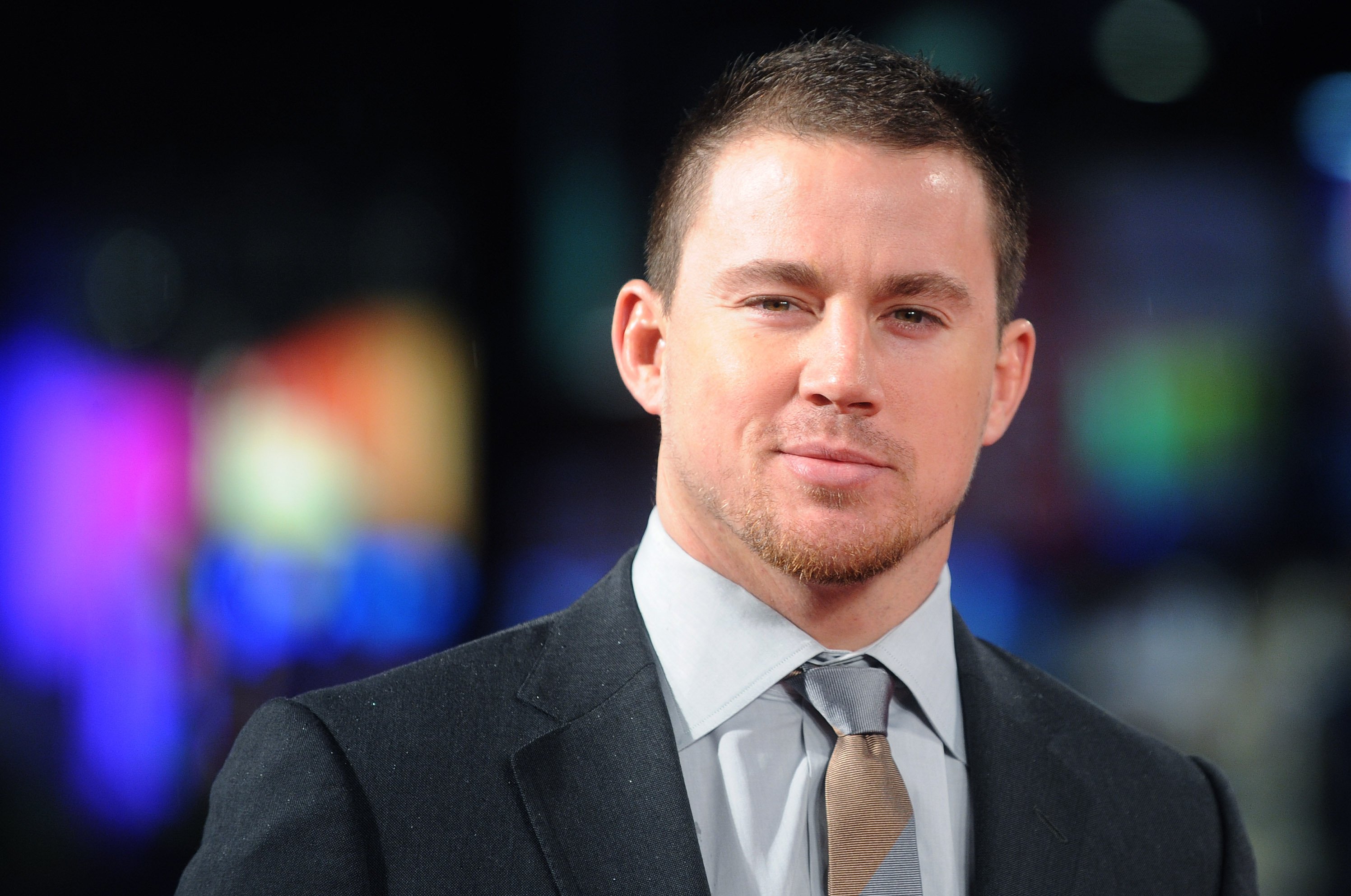 Channing Tatum in a suit while at a media event.
