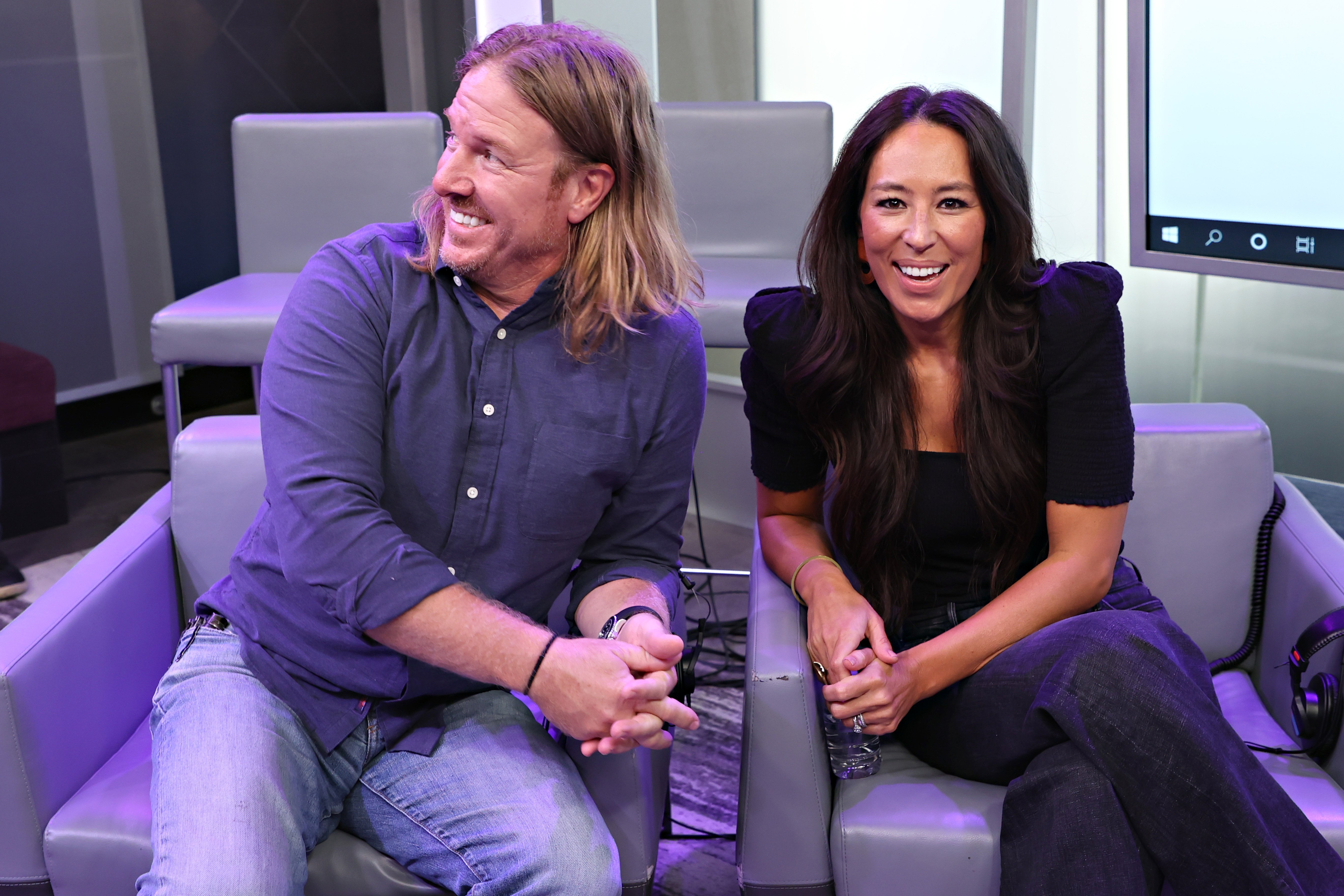 Chip and Joanna Gaines sit next to each other during a radio show with Today's Hoda Kotb.