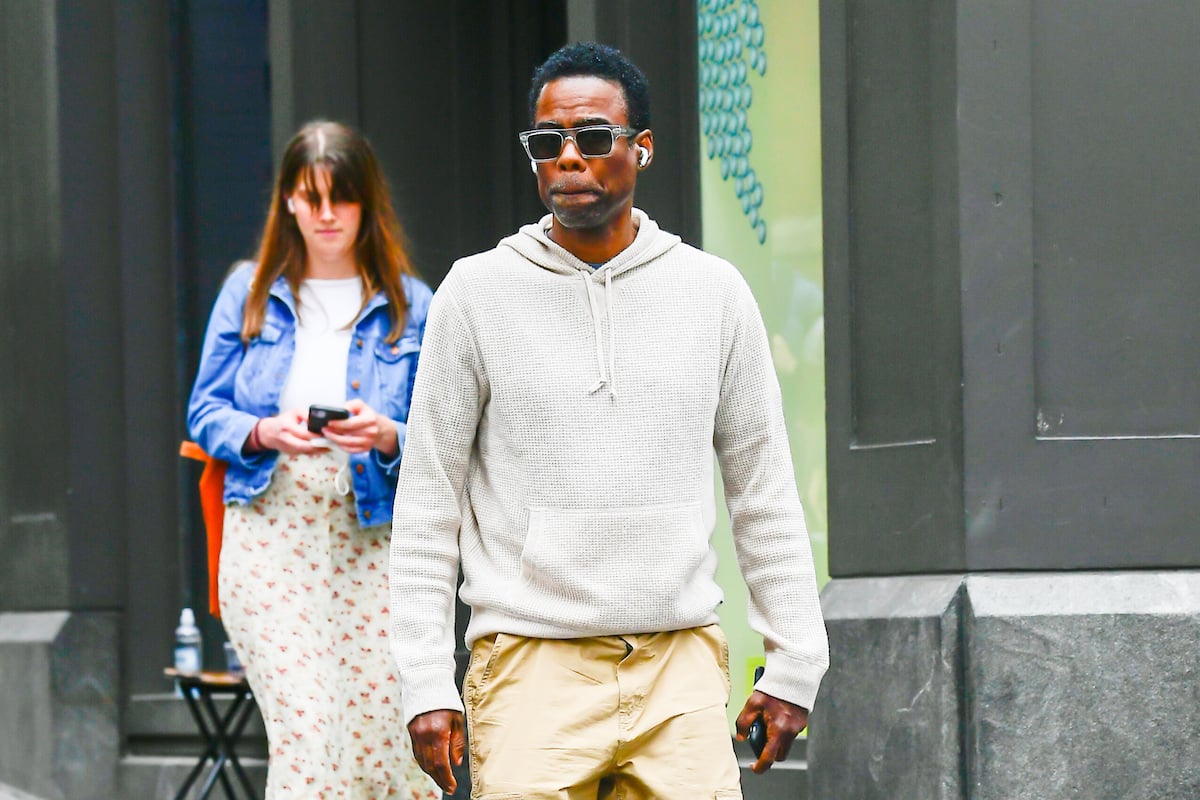 Chris Rock bites his lip walking in New York