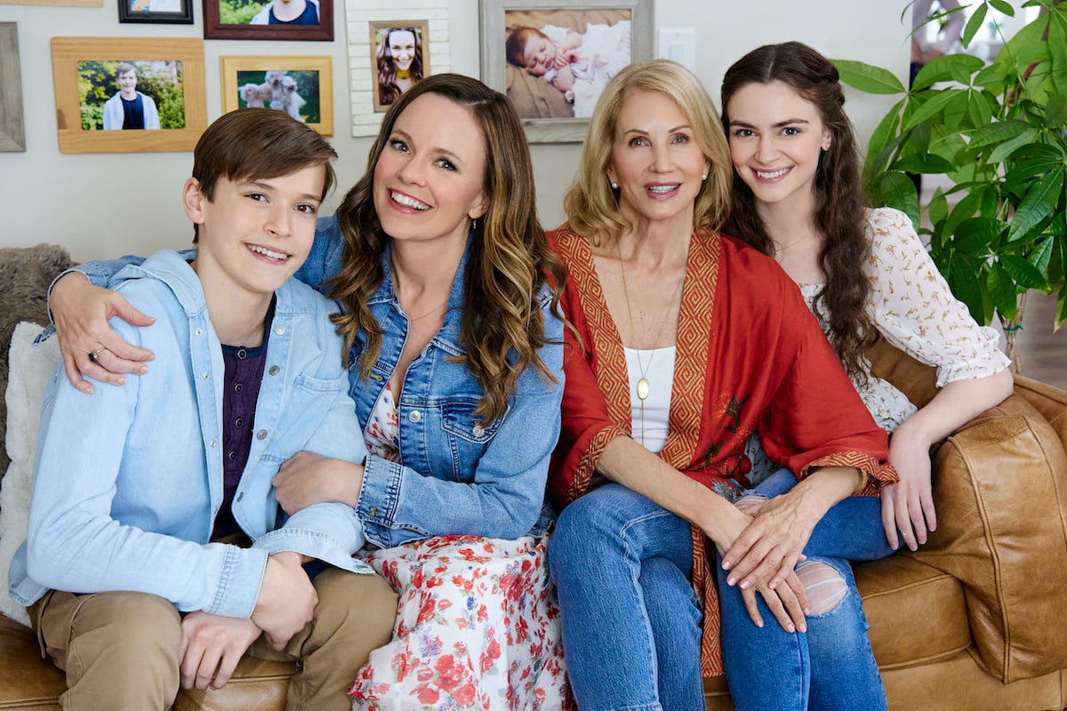 The cast of Hallmark Channel's movie 'Dating the Delaneys' sitting on a couch