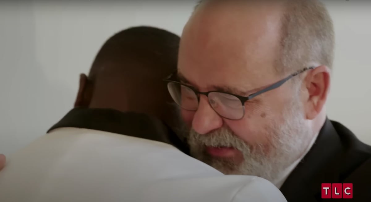 David Bieberly and Kobe Blaisé embrace on his wedding day to Emily on '90 Day Fiancé' Season 9 on TLC.