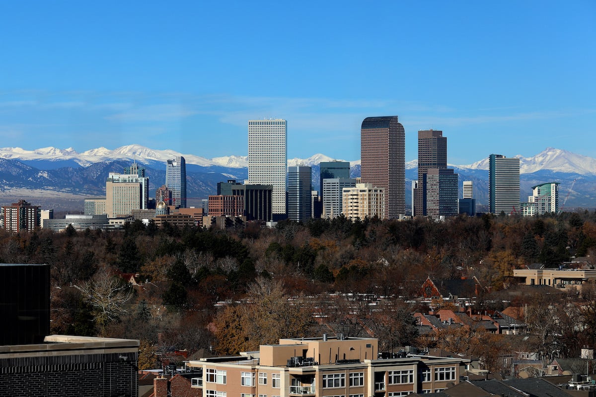 Denver skyline with Rocky Mountains in background